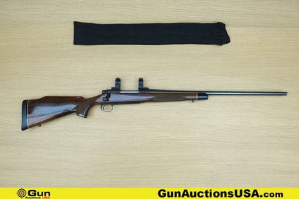 REMINGTON 700 300WM Rifle. Good condition, Normal Handling Marks, Scattered Spotting and/or Pitting.