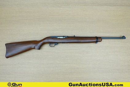 Ruger 10-22 .22 LR Rifle. Good condition, Normal Handling Marks, Scattered Spotting and/or Pitting.