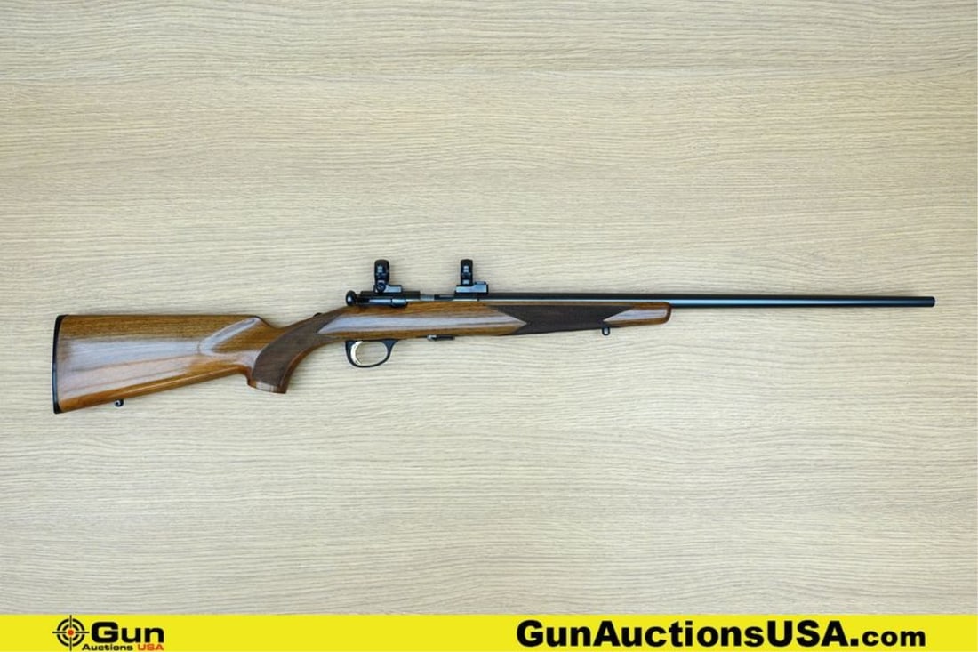 BROWNING MIROKU FIREARMS MFG CO. T-BOLT .22 LR Rifle. Very Good. 22" Barrel. Shiny Bore, Tight: BROWNING MIROKU FIREARMS MFG CO. T-BOLT .22 LR Rifle. Very Good. 22" Barrel. Shiny Bore, Tight Action Straight Bolt Features Checkered Straight Grained Walnut Stock, Sling Mounts, Polymer Butt Plate, 