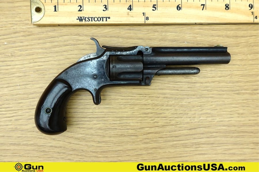 S&W 1 1/2 SECOND ISSUE .32 RF Revolver. Fair Condition. 3.5" Barrel. Features UNIQUE TOP BREAK: S&W 1 1/2 SECOND ISSUE .32 RF Revolver. Fair Condition. 3.5" Barrel. Features UNIQUE TOP BREAK Action, Removable Cylinder, Fixed Sights, Smooth SA Trigger, Straight Grained Wood Grips, Checkered Hamme