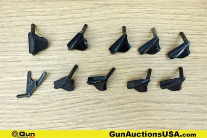 1911 Gun Parts. Good Condition. Ten Assorted 1911 Thumb Safeties.. (76665) (GSCM65)