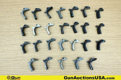 1911 Gun Parts. Good Condition. Twenty-Six Assorted 1911 Backstrap Safeties.. (76637) (GSCM59)