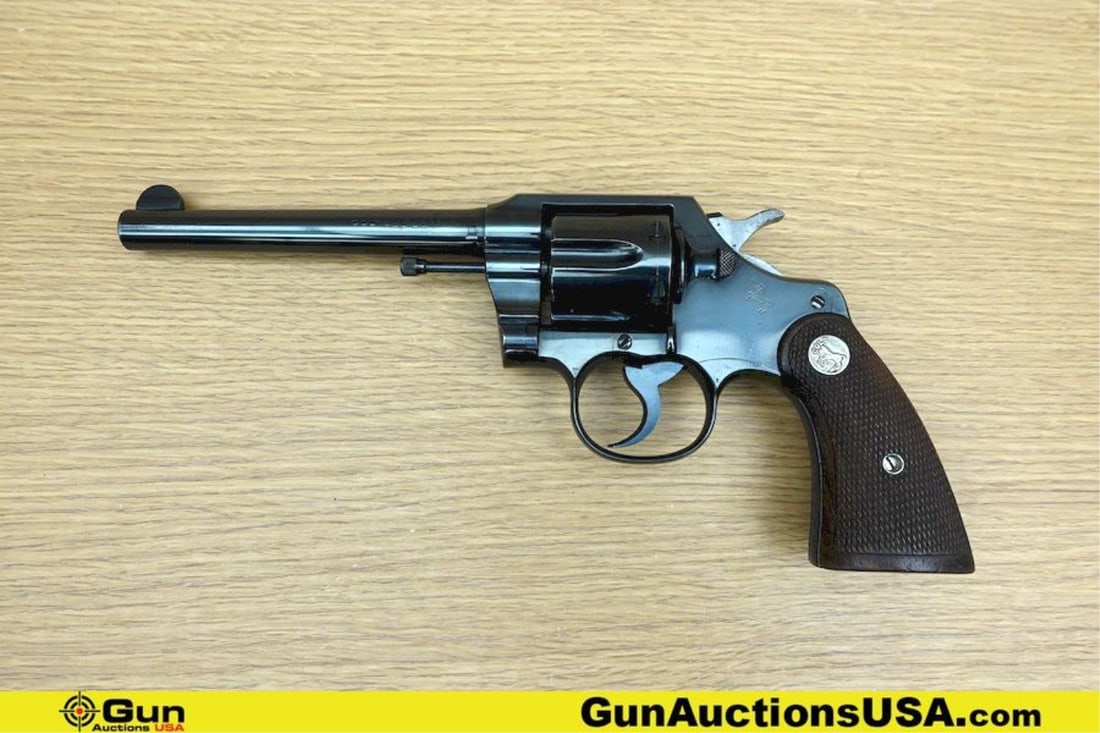 COLT OFFICIAL POLICE .38 Cal. COLLECTOR'S Revolver. Very Good. 6" Barrel. Shiny Bore, Tight Action: COLT OFFICIAL POLICE .38 Cal. COLLECTOR'S Revolver. Very Good. 6" Barrel. Shiny Bore, Tight Action MATCHING NUMBERS on Frame and Crane Arm! Features a Six Shot Fluted Cylinder, Checkered Wood Grips wi
