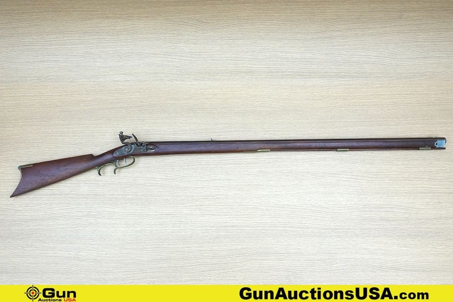 Felix Settle Rifle. Good condition, Normal Handling Marks, Scattered Spotting and/or Pitting. 40": Felix Settle Rifle. Good condition, Normal Handling Marks, Scattered Spotting and/or Pitting. 40" Barrel. Flint Lock Features Dual Set Trigger, Brass Trigger Guard and Butt Plate. Straight Grained Woo