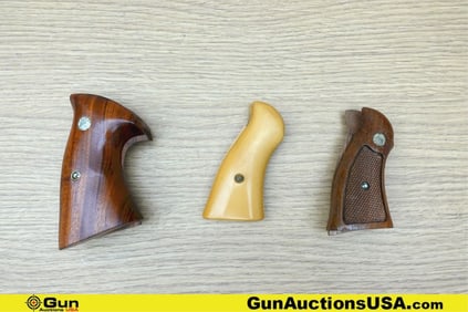 S&W Grips. Good Condition. Three S&W Assorted Grips. Two with S&W MEDALLIONS. . (77685) (GSCM69)