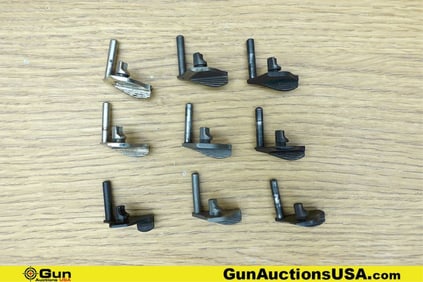 1911 Gun Parts. Good Condition. Nine Assorted 1911 Thumb Safeties.. (76667) (GSCM12)