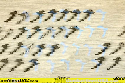 1911 Gun Parts. Good Condition. Twenty-Six Assorted 1911 Backstrap Safeties.. (76639) (GSCM20)
