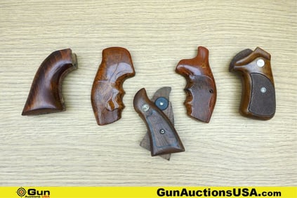 Grips. Good Condition. One S&W Set of Grips with Medallion, and Three Assorted Grips. . (77674)