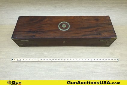 Manton & Co. Wood Gun Case. Good Condition. 33.5x10"x6" Wood Gun Case with Brass Corners. Lift Up