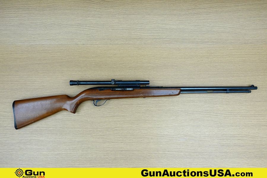 J.C. HIGGINS 25 .22 LR Rifle. Good condition, Normal Handling Marks, Scattered Spotting and/or: J.C. HIGGINS 25 .22 LR Rifle. Good condition, Normal Handling Marks, Scattered Spotting and/or Pitting. 22" Barrel. Shiny Bore, Tight Action Semi Auto SEARS, ROEBOCK and Co. on Barrel. Features Serrat