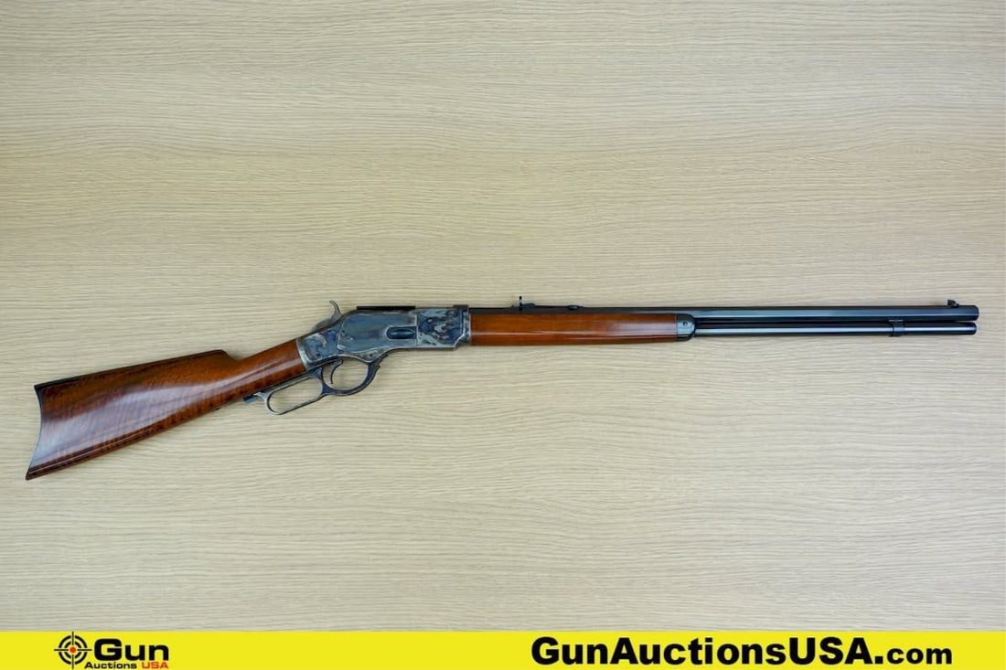 A. UBERTI 1873 .45LC Rifle. Excellent. 24" Barrel. Shiny Bore, Tight Action Lever Action Features a: A. UBERTI 1873 .45LC Rifle. Excellent. 24" Barrel. Shiny Bore, Tight Action Lever Action Features a Blued OCTAGONAL Barrel, Brushed Blued Mag Tube, Butt Plate and Hand Guard Cap, Straight Grained Wood