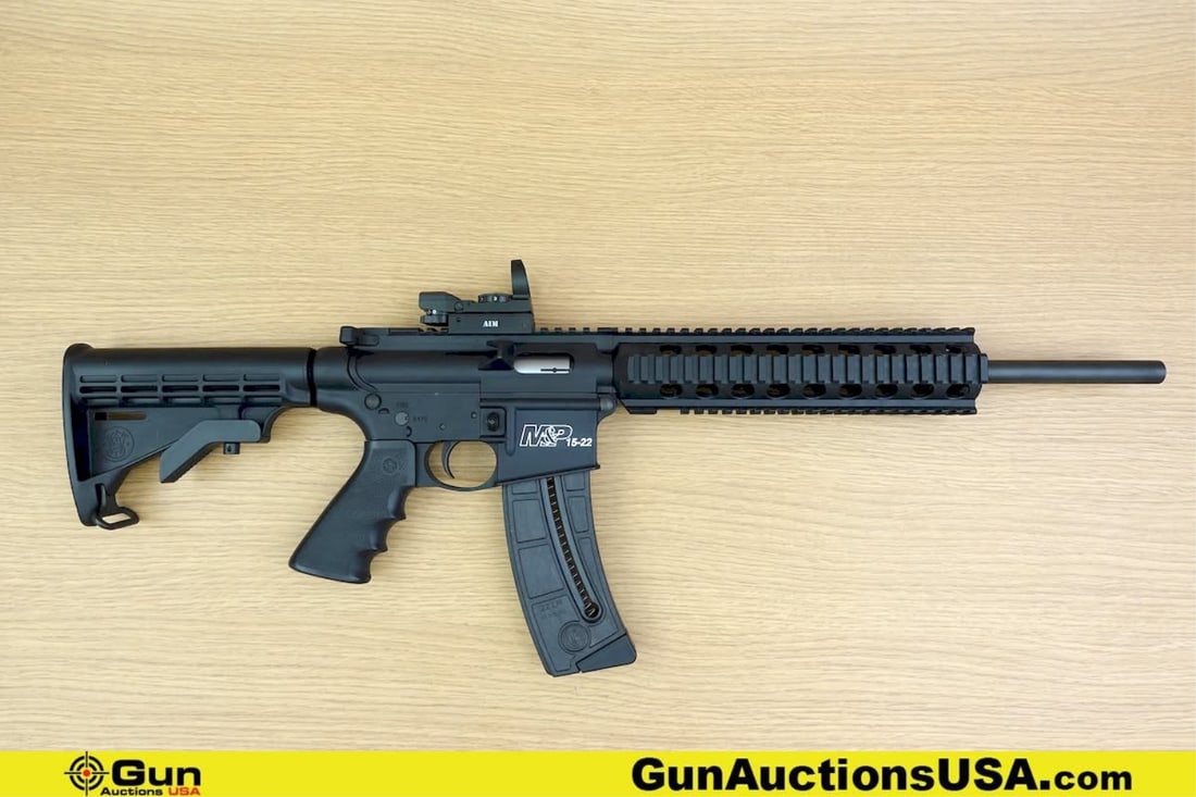 S&W M&P 15-22 .22 LR Rifle. Very Good. 16.5" Barrel. Shiny Bore, Tight Action Semi Auto Features a: S&W M&P 15-22 .22 LR Rifle. Very Good. 16.5" Barrel. Shiny Bore, Tight Action Semi Auto Features a Polymer Quad rail and Flat Top Upper, AIM Red Dot Sight, Carbon steel barrel with Armornite finish, A