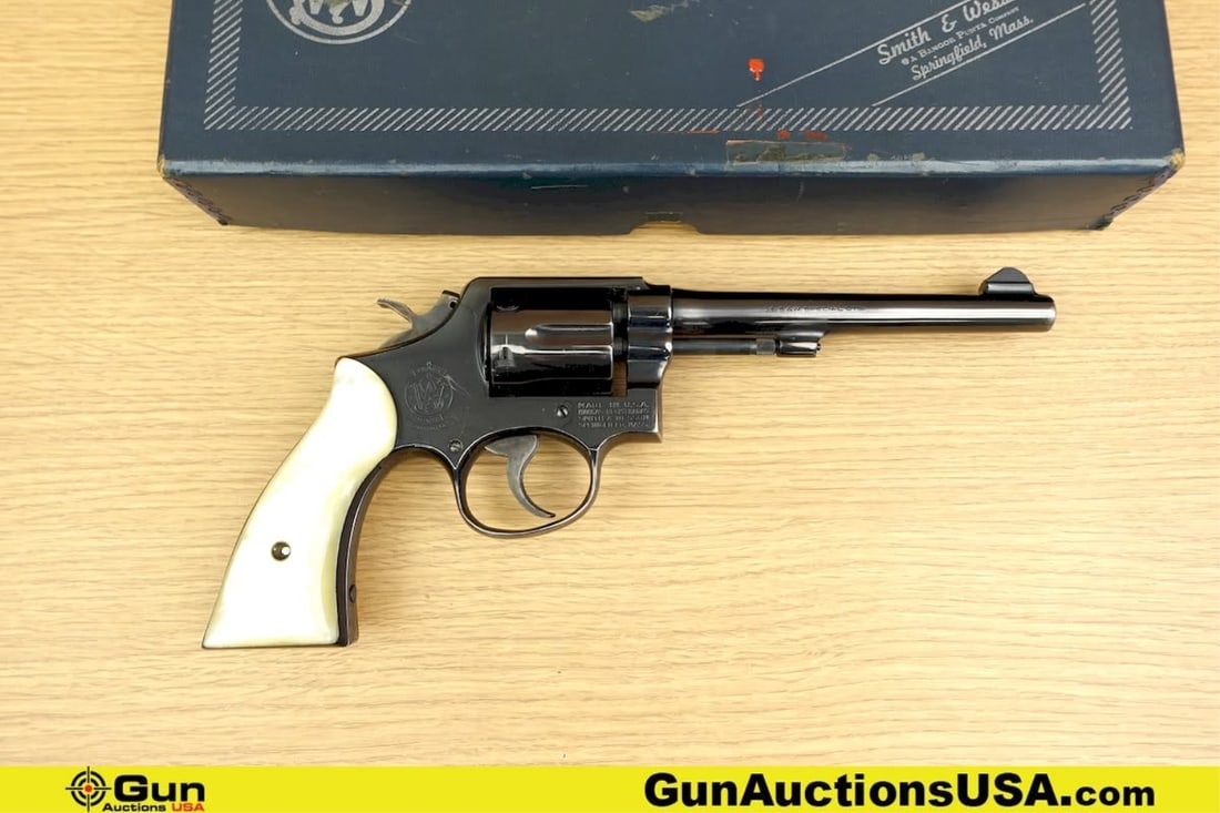S&W 10-5 .38 S&W SPECIAL CTG Revolver. Good condition, Normal Handling Marks, Scattered Spotting: S&W 10-5 .38 S&W SPECIAL CTG Revolver. Good condition, Normal Handling Marks, Scattered Spotting and/or Pitting. 6" Barrel. Shiny Bore, Tight Action Features a Case Hardened SA/DA Hammer and Trigger,