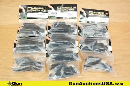 Armordillo Concealment Holsters. Like New. Ten Light Bearing Kydex Holsters with Packaging. .