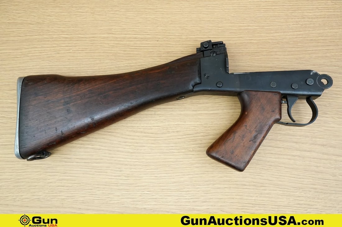 Belgium Surplus Butt Stock Assembly. Very Good. Belgian FAL Butt Stock Assembly, With Straight: Belgium Surplus Butt Stock Assembly. Very Good. Belgian FAL Butt Stock Assembly, With Straight Grained Wood Pistol Grip and Stock, Metal Butt Plate, with Trap Door. Flip Up Adjustable Rear Sight with 
