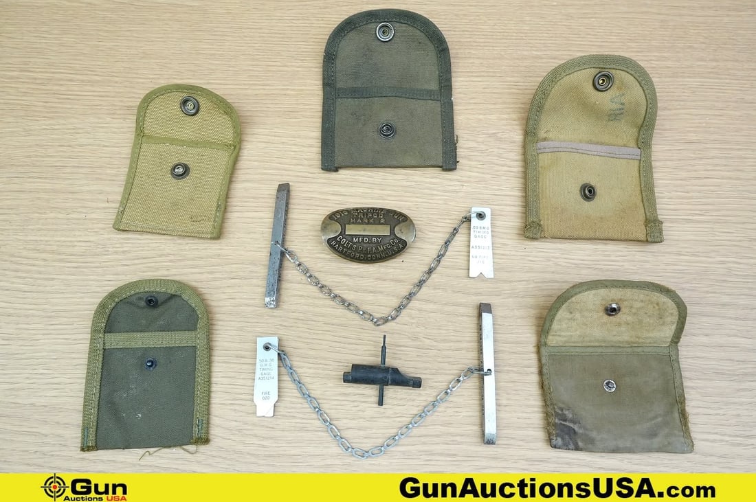 Colt, Militaria COLLECTOR"S Tri Pod Name Plate, Gauges, Etc. . Very Good. One Colt Mark 2 1918: Colt, Militaria COLLECTOR"S Tri Pod Name Plate, Gauges, Etc. . Very Good. One Colt Mark 2 1918 Machine Gun Tri-Pod Name Plate. Two 50 Cal Timing Gauges and One Gas Cylinder Reamer and Five Canvas Pouc