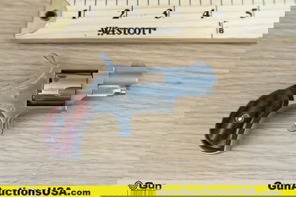 North American .22 Short Revolver. Very Good. 1 1/8" Barrel. Shiny Bore, Tight Action Features Fixed