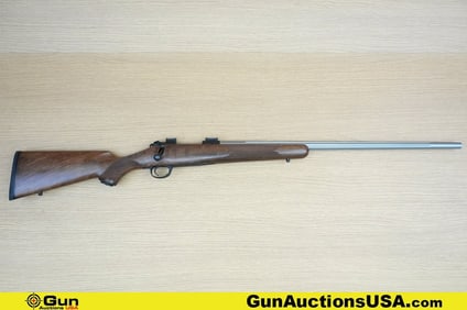 Kimber 84M .22-250 Rifle. Good condition, Normal Handling Marks, Scattered Spotting and/or Pitting.