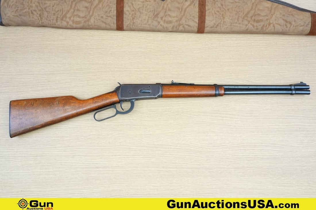 Winchester 94 30-30 WIN Rifle. Good condition, Normal Handling Marks, Scattered Spotting and/or: Winchester 94 30-30 WIN Rifle. Good condition, Normal Handling Marks, Scattered Spotting and/or Pitting. 20" Barrel. Shiny Bore, Tight Action Lever Action Features a Walnut Stock and Hand Guard, with 