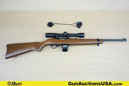 RUGER 10/22 .22 LR Rifle. Good condition, Normal Handling Marks, Scattered Spotting and/or Pitting.