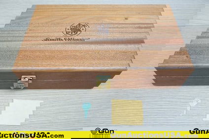 S&W Presentation Case. . Like New. S&W Wood Blue Velvet Lined Presentation Case with Key, 14.5"