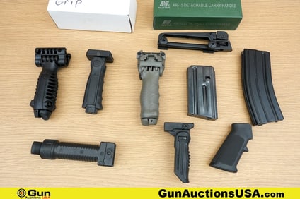 Bushmaster, Etc. Magazines, Carry Handle, Etc. . Very Good. Assorted AR 15 Accessories; Two 5.56