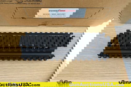 Surefire M69 Accessories. Excellent. One Quad rail 870 Handguard. Includes Original Box and Papers..