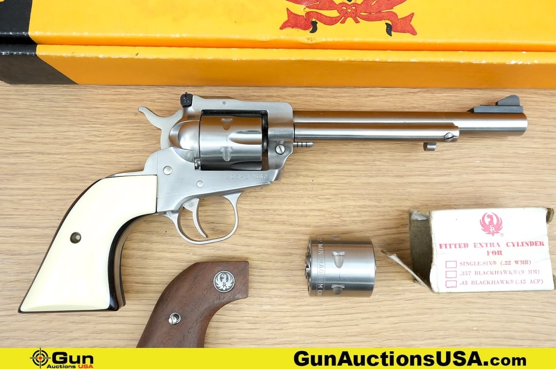 RUGER NEW MODEL SINGLE-SIX .22 LR Revolver. Very Good. 6.5" Barrel. Shiny Bore, Tight Action: RUGER NEW MODEL SINGLE-SIX .22 LR Revolver. Very Good. 6.5" Barrel. Shiny Bore, Tight Action Features a Six Shot Removable Cylinder, STUNNING After Market GRIPS, Removable Fixed Serrated Front Sight,