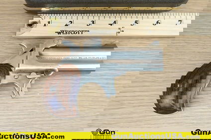 DERRINGER M-1 .45 LC/.410 GA. Pistol. Good condition, Normal Handling Marks, Scattered Spotting