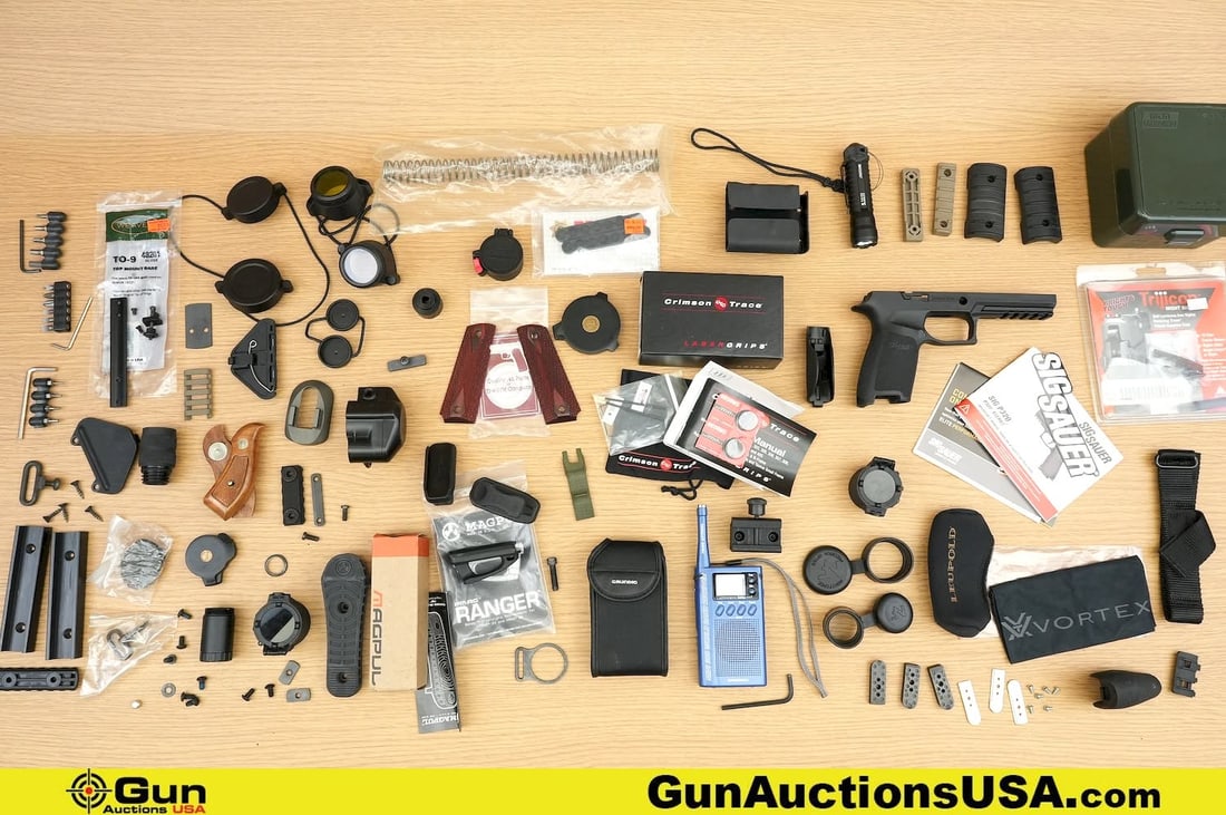 Sig, MTM, Crimson Trace, Etc. Gun Pars, Accessories . Very Good. Approx. 55 Pistol and Revolver: Sig, MTM, Crimson Trace, Etc. Gun Pars, Accessories . Very Good. Approx. 55 Pistol and Revolver Parts and Accessories. Some Include Original Packaging. . (80598) (GSCP78)