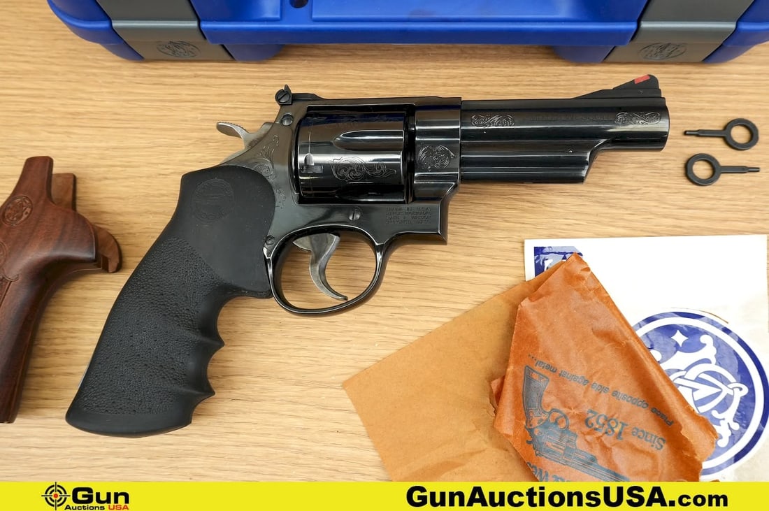 S&W 29-10 .44 MAGNUM APPEARS UNFIRED Revolver. Excellent. 4" Barrel. Shiny Bore, Tight Action: S&W 29-10 .44 MAGNUM APPEARS UNFIRED Revolver. Excellent. 4" Barrel. Shiny Bore, Tight Action Features a Pinned Ramped, Serrated Front Sight, with a Polished Blued Finish, GORGEOUS Laser Engraved Fili