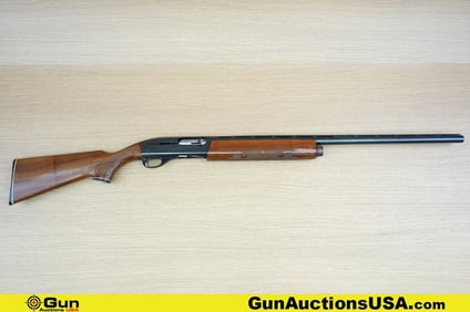 REMINGTON 1100 12 ga. Shotgun. Good Condition, Normal Handling Marks. 27.5" Barrel. Shiny Bore,