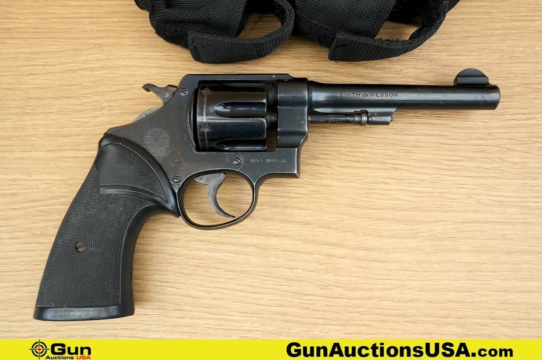 S&W 1937 .45 Revolver. Good Condition, Normal Handling Marks. 5.5" Barrel. Shiny Bore, Tight Action: S&W 1937 .45 Revolver. Good Condition, Normal Handling Marks. 5.5" Barrel. Shiny Bore, Tight Action A Brazilian Contract Smith, with Machined Fixed Front Sight, MATCHING NUMBERS on Cylinder and Frame,