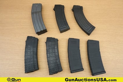 Circle 10, Surefire, Magpul, Etc. 5.56, 7.62x39 . Very Good. Magazines Two 5.56 Polymer AK Mags. One