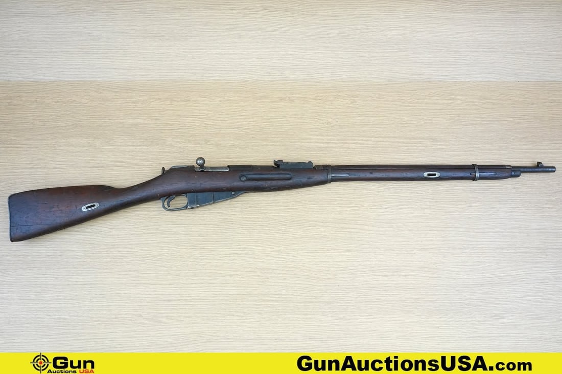 TULA MOSIN NAGANT 7.62 x 54r Rifle. Fair Condition. 29" Barrel. Dark Bore Bolt Action Features a: TULA MOSIN NAGANT 7.62 x 54r Rifle. Fair Condition. 29" Barrel. Dark Bore Bolt Action Features a Straight Grained Wood Stock and Hand Guard, Blued Barrel and Action, In the White bolt, Internal Mag wi