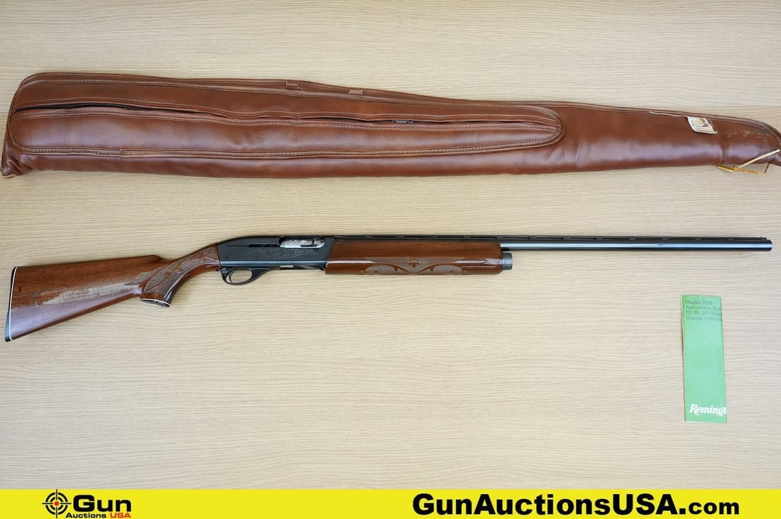 REMINGTON 1100 12 ga. Shotgun. Very Good. 30" Barrel. Shiny Bore, Tight Action Semi Auto . Features: REMINGTON 1100 12 ga. Shotgun. Very Good. 30" Barrel. Shiny Bore, Tight Action Semi Auto . Features a Laminate Walnut stock, with Checkered Hand Grip and Fore Grip. Engraved Receiver, Dark Blued Finis