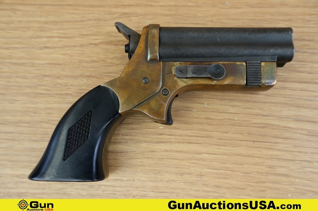Chicago Derringer Pepper Box .22 Caliber REPLICA PISTOL. Good Condition, Normal Handling Marks. 2.5": Chicago Derringer Pepper Box .22 Caliber REPLICA PISTOL. Good Condition, Normal Handling Marks. 2.5" Barrel. Single Shot. REPLICA PISTOL, with Polished Brass Frame, Bakelite Grips, Blued Barrel. A UNI