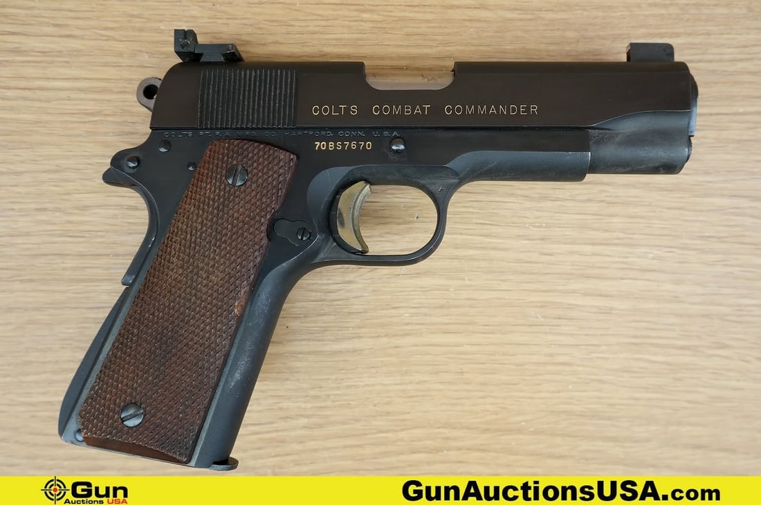 COLT COMBAT COMMANDER .45 AUTO COLLECTOR'S Pistol. Good Condition, Normal Handling Marks. 4.25": COLT COMBAT COMMANDER .45 AUTO COLLECTOR'S Pistol. Good Condition, Normal Handling Marks. 4.25" Barrel. Shiny Bore, Tight Action Semi Auto . Features a Custom Right Handed Wood Grip with Thumb Rest, G