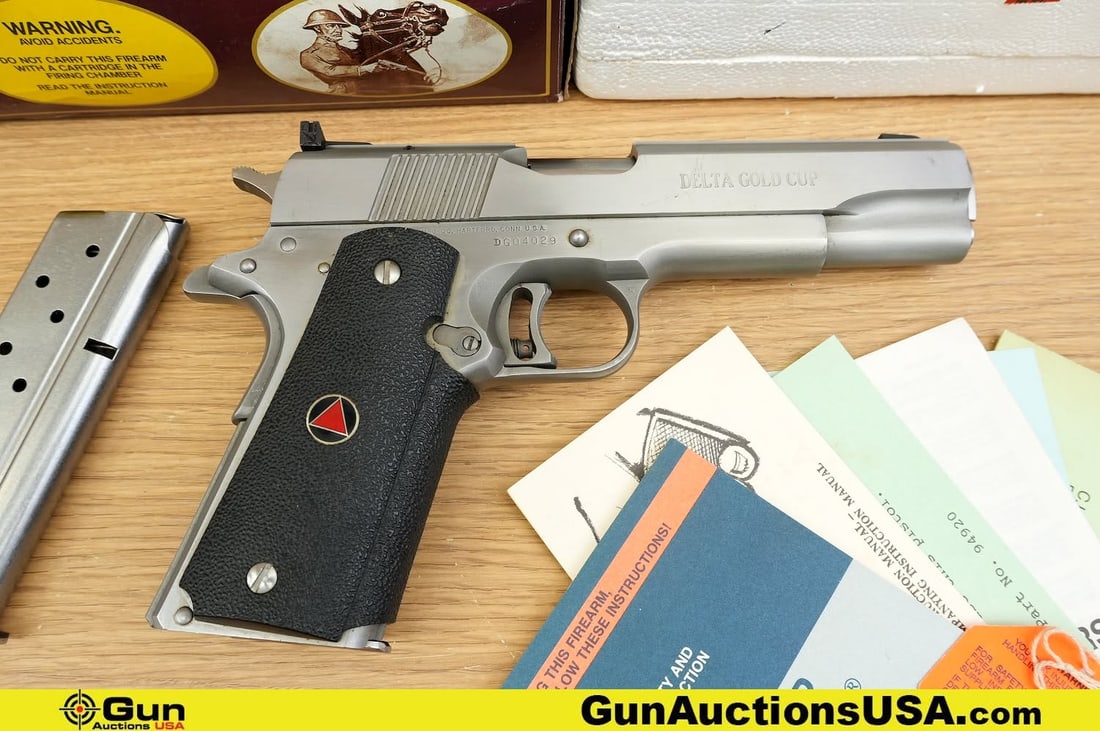 COLT DELTA GOLD CUP 10MM COLLECTOR'S Pistol. Very Good. 5" Barrel. Shiny Bore, Tight Action Semi: COLT DELTA GOLD CUP 10MM COLLECTOR'S Pistol. Very Good. 5" Barrel. Shiny Bore, Tight Action Semi Auto . A STUNNING DELTA GOLD CUP Featuring a Distinctive Triangular Grip Emblem, Adjustable Rear Sight,