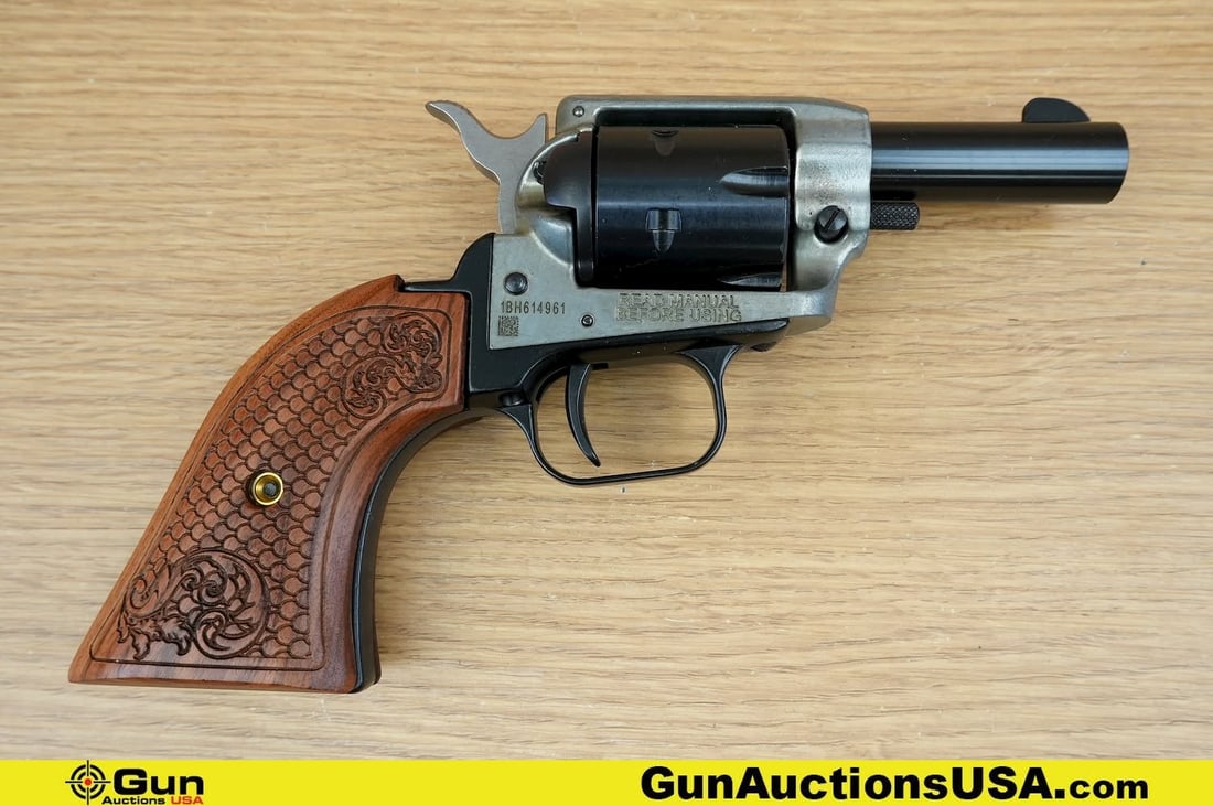 Heritage MFG BARKEEP .22 CAL Revolver. Very Good. 2" Barrel. Shiny Bore, Tight Action . Features a: Heritage MFG BARKEEP .22 CAL Revolver. Very Good. 2" Barrel. Shiny Bore, Tight Action . Features a Compact Frame, with Custom Engraved Wood Grips with Texturing, Matte Barrel and Grip with Polished Re