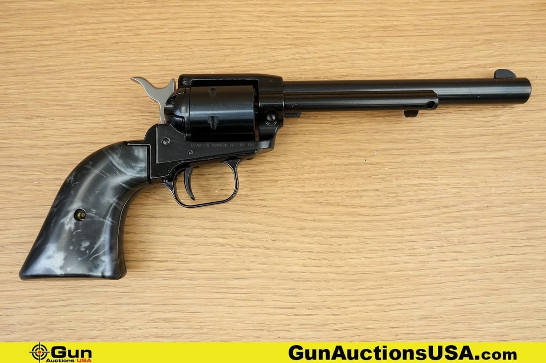 Heritage MFG ROUGH RIDER .22 WMR Revolver. Very Good. 6" Barrel. Shiny Bore, Tight Action . Features: Heritage MFG ROUGH RIDER .22 WMR Revolver. Very Good. 6" Barrel. Shiny Bore, Tight Action . Features a Precision-Machined Barrel, Checkered Hammer, Left Hand Ejector, Left Side Thumb Safety with a Rig