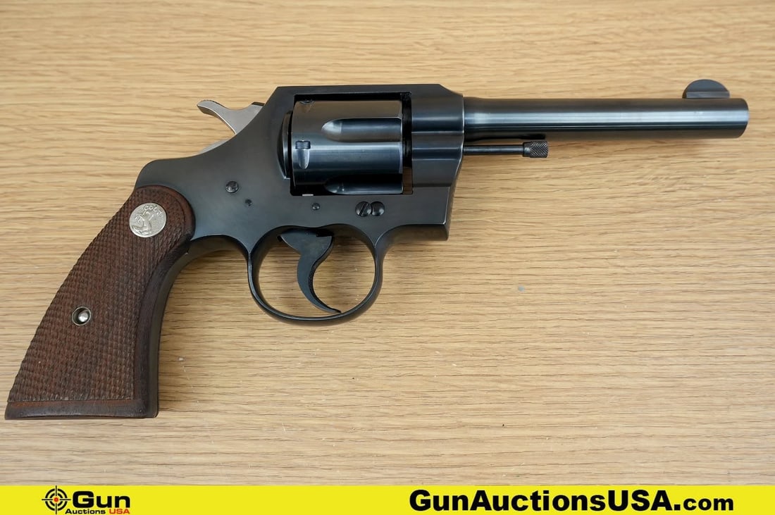 COLT OFFICIAL POLICE .38 Cal. COLLECTOR'S Revolver. Excellent. 4.75" Barrel. Shiny Bore, Tight: COLT OFFICIAL POLICE .38 Cal. COLLECTOR'S Revolver. Excellent. 4.75" Barrel. Shiny Bore, Tight Action . Features a BEAUTIFUL Blued Finish, Six Shot Fluted Cylinder, Checkered Walnut Grips, with Colt M