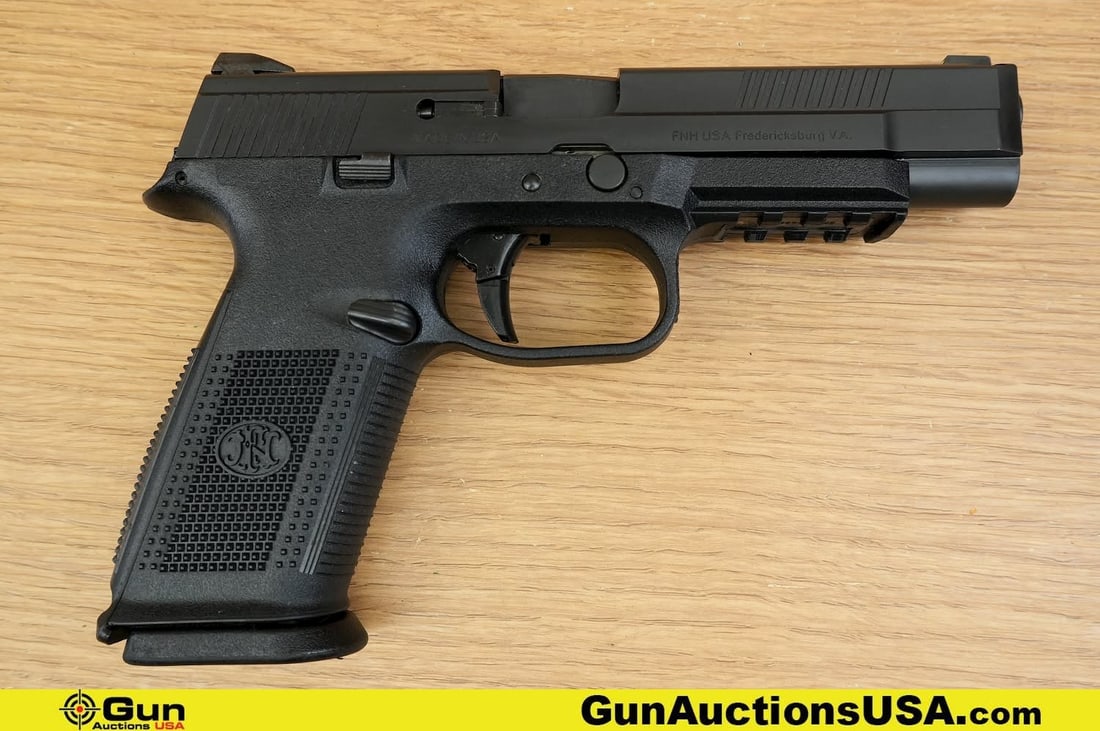 FNH FNS-40 .40 S&W Pistol. Very Good. 5" Barrel. Shiny Bore, Tight Action Semi Auto . Striker Fired,: FNH FNS-40 .40 S&W Pistol. Very Good. 5" Barrel. Shiny Bore, Tight Action Semi Auto . Striker Fired, and Featuring an Aggressive Textured Polymer Grip and Frame, Front Accessory Rail, Enlarged Trigger