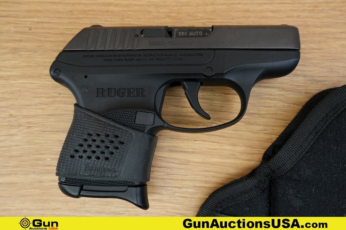 RUGER LCP .380 AUTO Pistol. Good Condition, Normal Handling Marks. 3" Barrel. Shiny Bore, Tight: RUGER LCP .380 AUTO Pistol. Good Condition, Normal Handling Marks. 3" Barrel. Shiny Bore, Tight Action Semi Auto . Features a Polymer Grip and Frame, Pachmayr Rubber Grip, SA Only, Left Side Slide Loc