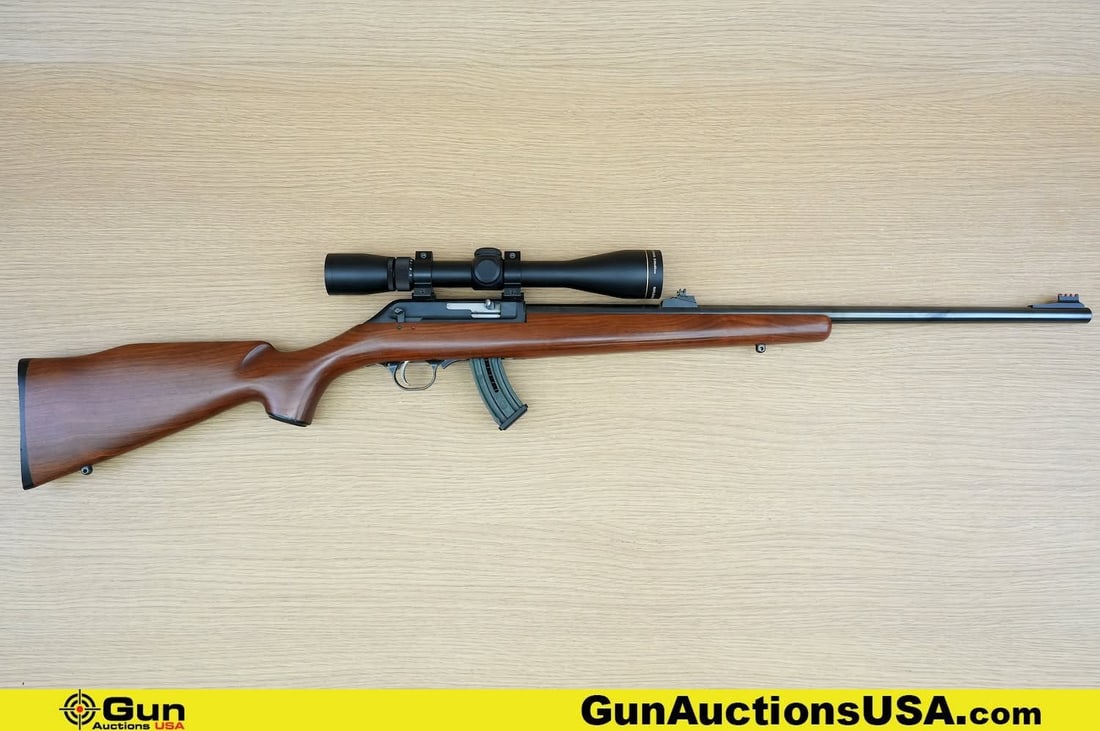 Thompson Center 22 CLASSIC .22 LR Rifle. Good Condition, Normal Handling Marks. 22" Barrel. Shiny: Thompson Center 22 CLASSIC .22 LR Rifle. Good Condition, Normal Handling Marks. 22" Barrel. Shiny Bore, Tight Action Semi Auto. Featuring a Full Length Walnut Stock, with a Right Side Thumb Safety, an