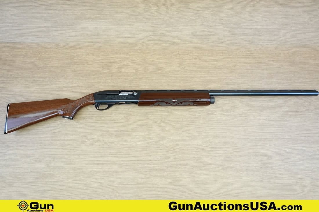REMINGTON 1100 12 ga. Shotgun. Very Good . 30" Barrel. Shiny Bore, Tight Action Semi Auto .: REMINGTON 1100 12 ga. Shotgun. Very Good . 30" Barrel. Shiny Bore, Tight Action Semi Auto . STUNNING, Featuring a Laminated Checkered Walnut Stock and Front Grip, Full Length Ventilated Rib Barrel, wi