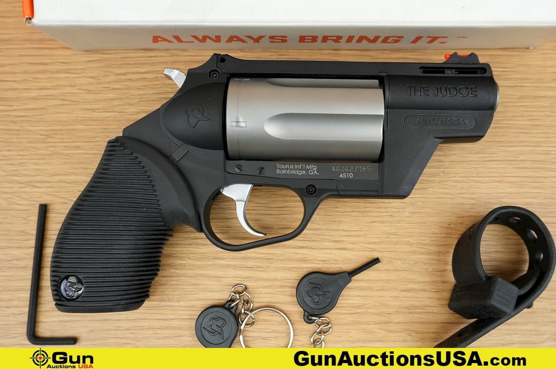 TAURUS THE JUDGE 45LC/.410 Revolver. Excellent. 2" Barrel. Shiny Bore, Tight Action . Features a: TAURUS THE JUDGE 45LC/.410 Revolver. Excellent. 2" Barrel. Shiny Bore, Tight Action . Features a Vented Rubberized Grip, Enlarged Trigger Guard, Textured Hammer and Cylinder Release, Public Defender P