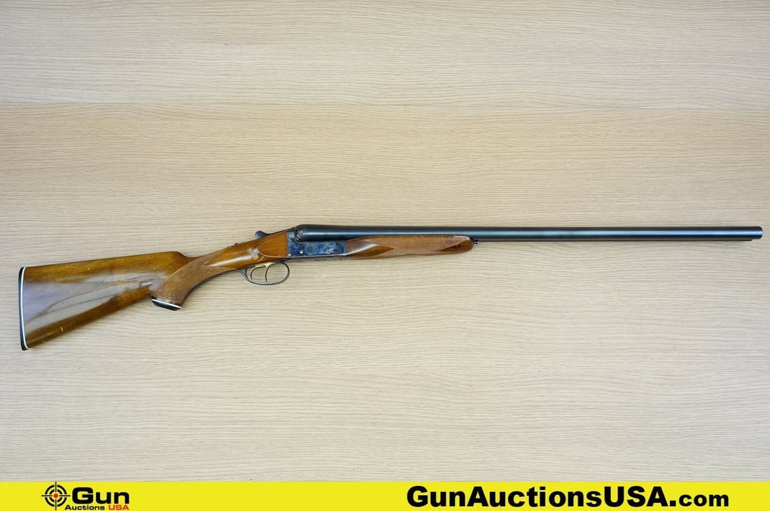 Ugartechea SIDE BY SIDE 12 ga. Shotgun. Good Condition, Normal Handling Marks. 28" Barrel. Shiny: Ugartechea SIDE BY SIDE 12 ga. Shotgun. Good Condition, Normal Handling Marks. 28" Barrel. Shiny Bore, Tight Action Break Action . Features Checkered Walnut Stock, and Front Grip, Tang Safety, Elegant