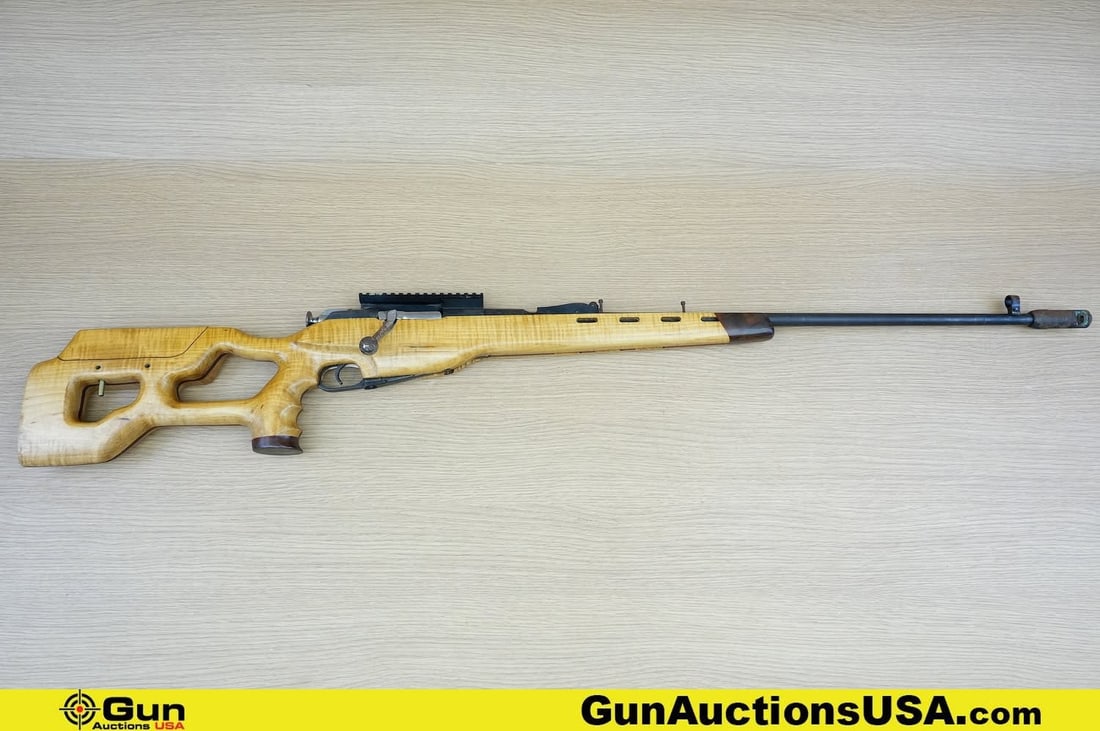 IZHEVSK M91/30 7.62 x 54r Rifle. Fair Condition. 32" Barrel. Bolt Action . Features a Flash: IZHEVSK M91/30 7.62 x 54r Rifle. Fair Condition. 32" Barrel. Bolt Action . Features a Flash Suppressor, Shrouded Front Sight, Picatinny Top Rail, Internal Magazine Fed, Dragonoff Style Wood Stock, Dur