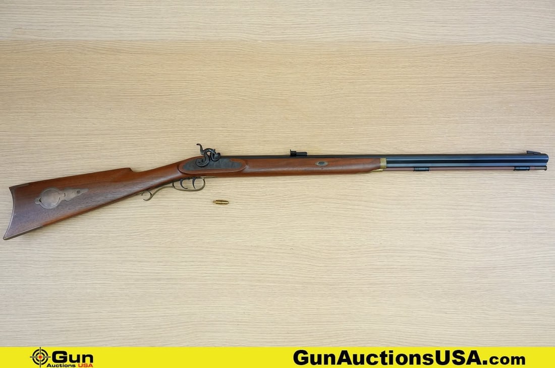 Thompson Center .45 Caliber Black Powder Rifle. Very Good. 27" Barrel. Single Shot . Features a: Thompson Center .45 Caliber Black Powder Rifle. Very Good. 27" Barrel. Single Shot . Features a OCTAGONAL BARREL, Black Front Blade Sight, Adjustable Rear Sight, Textured Hammer, Full Length Wood Stoc